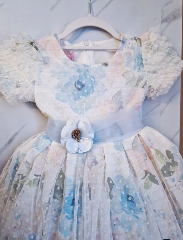 Elegant floral dress with flower detail.