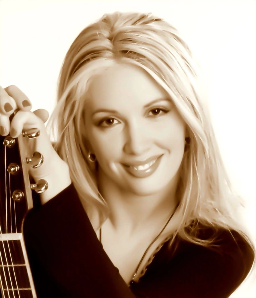 Jenny Tate with her Boulder Creek Guitar