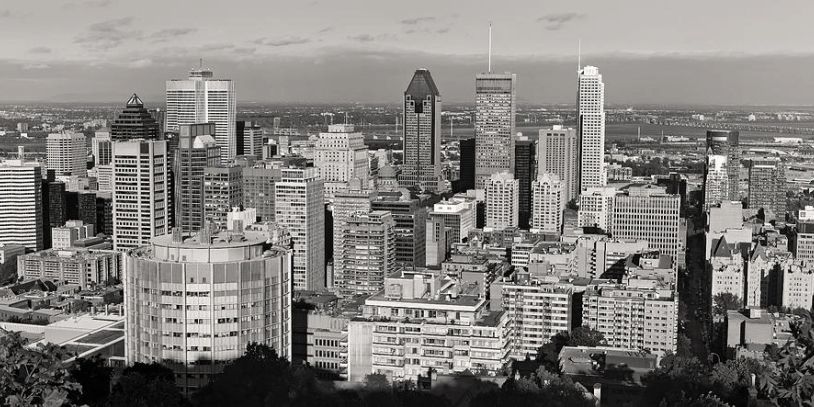 Black and white city skyline with various high-rise buildings.