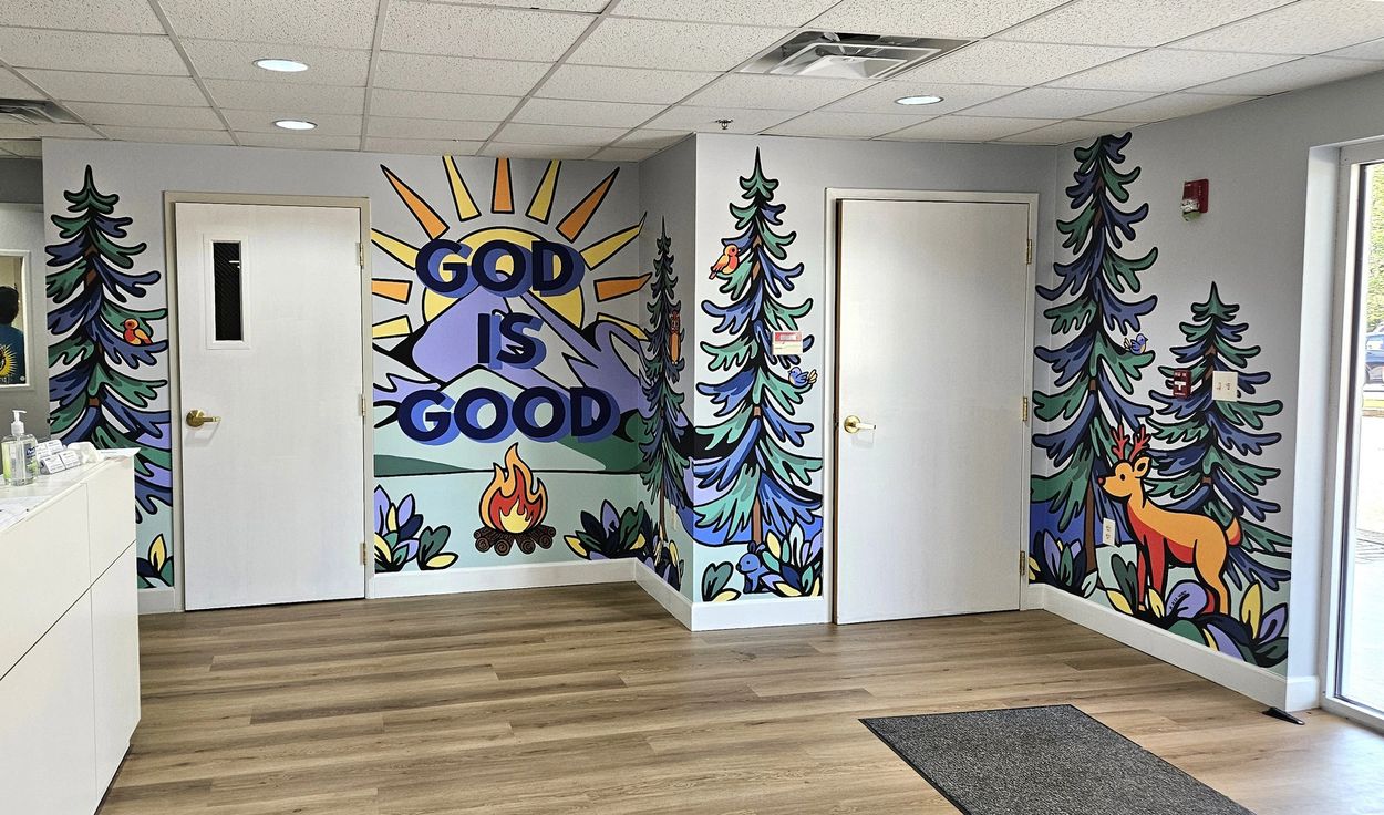 Colorful mural with nature and religious theme.