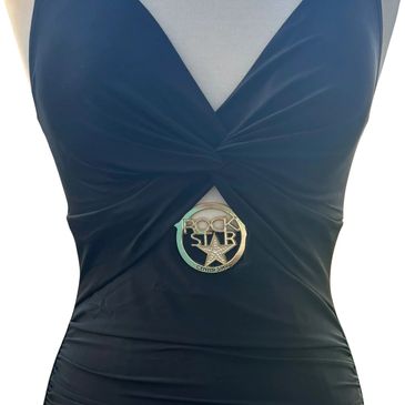 The Rock Star medallion slipped into the front cutout of a swimsuit.