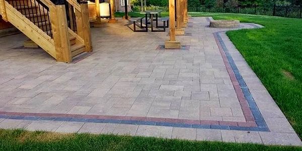 Backyard patio, interlocking, color borders, sod