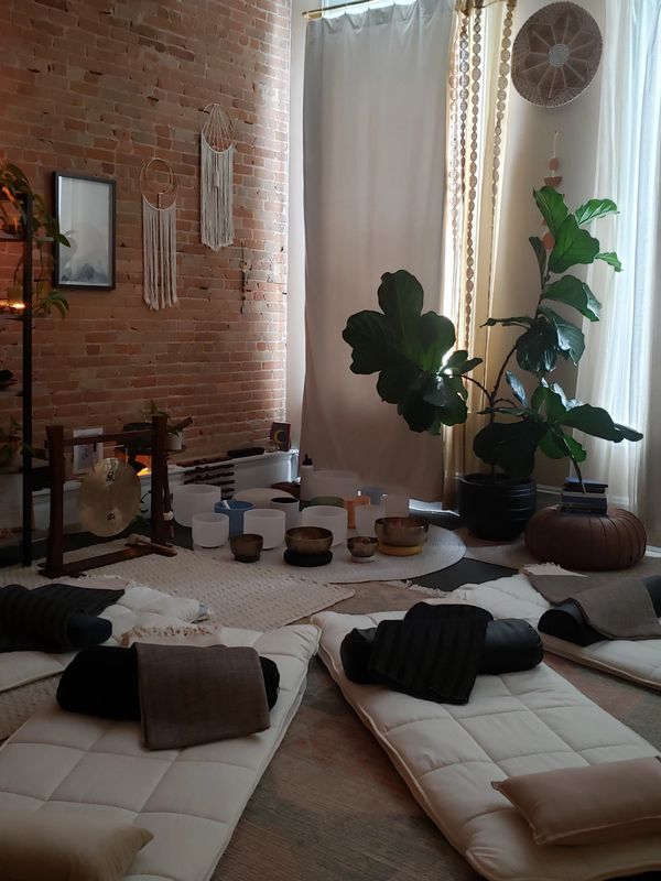 Group Sound Healing Session with fleece covered yoga mats and crystal singing bowls, Himalayan singi