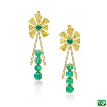 Elegant gold earrings with green emeralds and diamond accents.