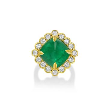 Elegant gold ring with a large green emerald and surrounding diamonds.