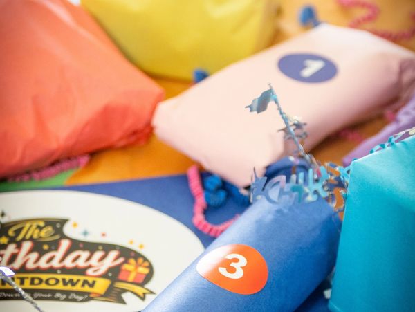 Colorful countdown balloons preparing for a birthday celebration.