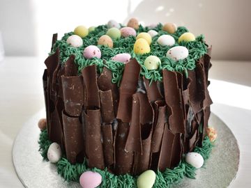 easter nest cake with cadbury mini eggs and dark chocolate bark