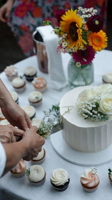 wedding cake and cupcakes