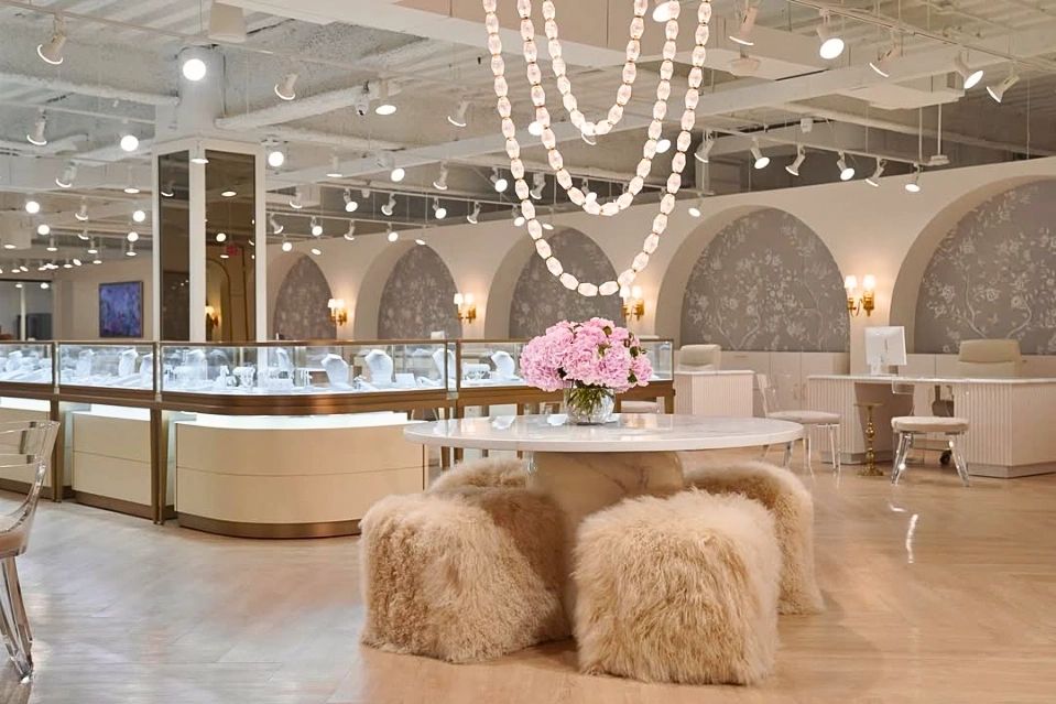 Elegant jewelry store interior with plush seating and soft lighting.