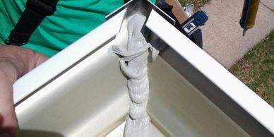 Applying silicone to the interior gutter joints
