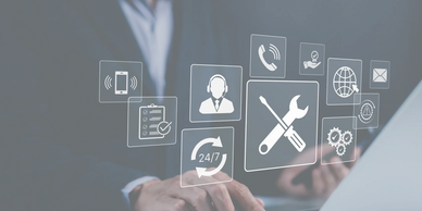 Businessman interacting with digital support and communication icons on laptop.