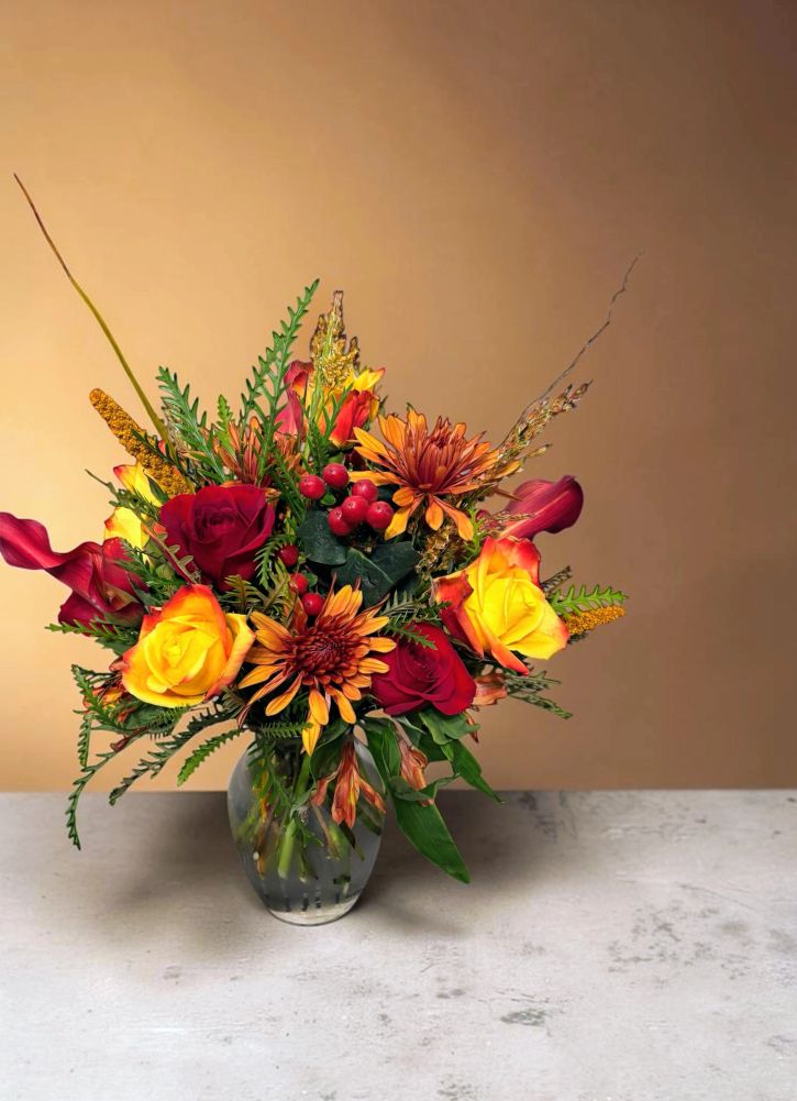 Vibrant autumn flower bouquet in a vase.