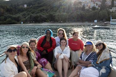 Group of friends enjoying a boat ride on a sunny day.