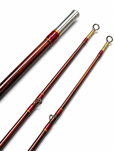 Three-section fishing rod with red and gold accents against white background.