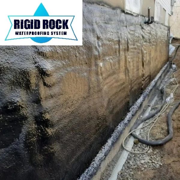 Waterproofing application on a building foundation wall by Rigid Rock.