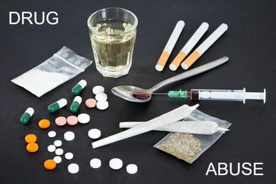 Random drugs scattered on table.