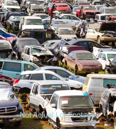 Scrap yard of junk cars.