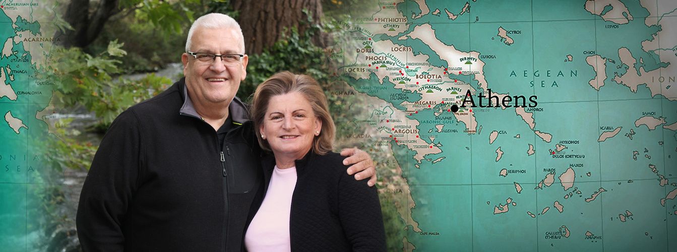 Alex and Eleni with a map of Greece