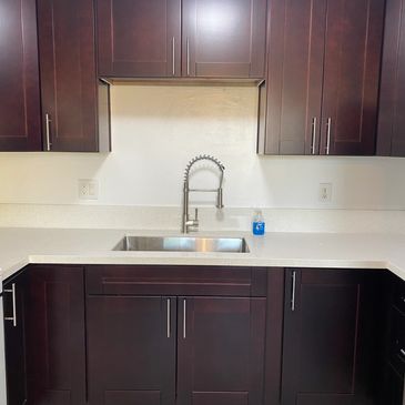 Kitchen remodel with brand new kitchen cabinets countertops and brushed nickel hardware
