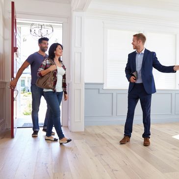 Male realtor showing a home