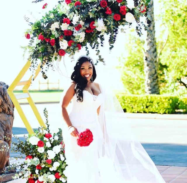 A happy bride holding a bouquet of flowers