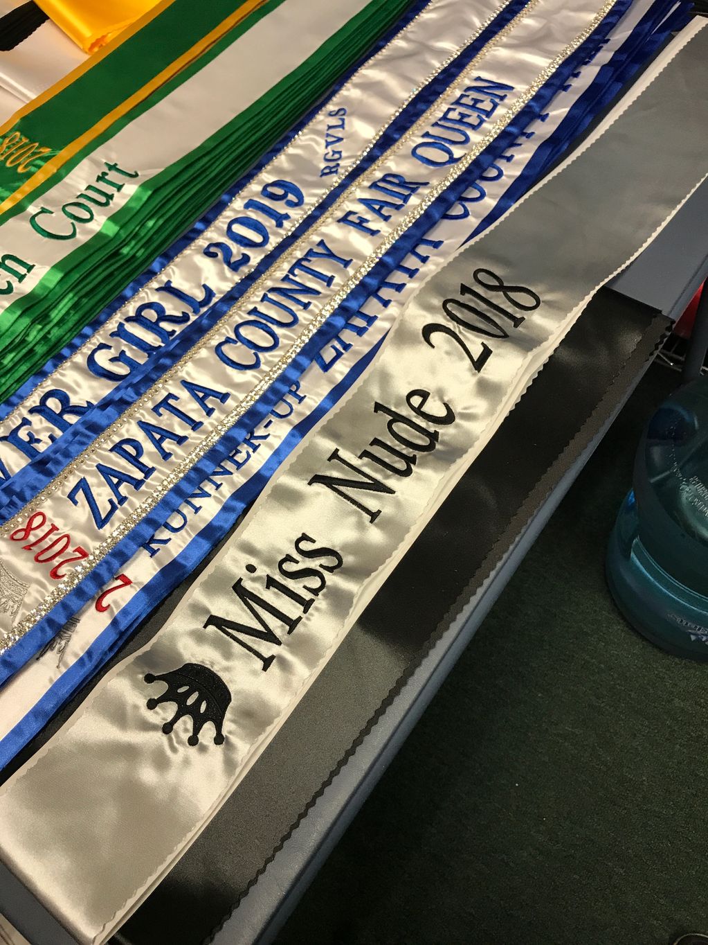 Zapata County Fair: White Center, Royal Blue Wraparound, Top Text (2018) Perpendicular in Red, Title