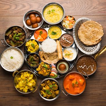 Traditional Indian thali with a variety of dishes and chapati.