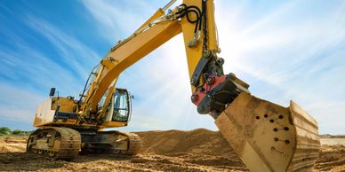 An excavator engaged in excavating dirt