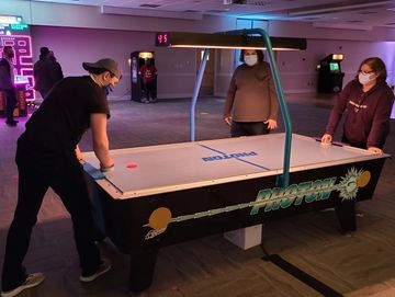 Overhead scoring takes your air hockey arcade rental to the next level.