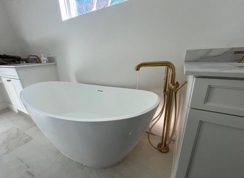 modern bathtub and fixtures in home