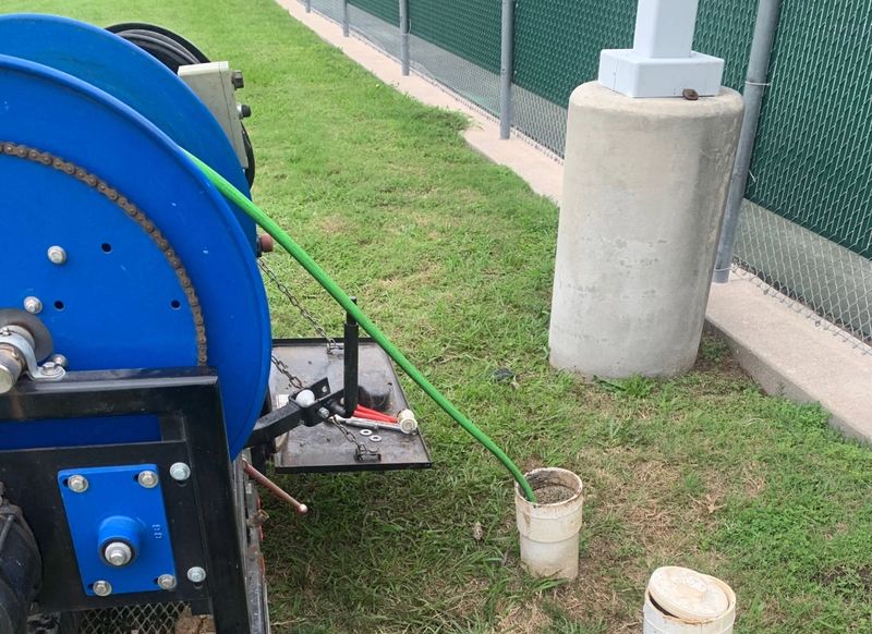 hydro jetting machine at work in outdoor pipe