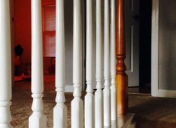 A close-up of the white color railing for steps