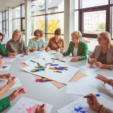 Group coloring activity in a bright room.