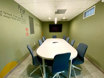 mindwarehouse office space for rent withconference room table and blue chairs