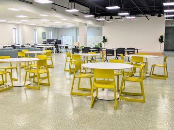 mindwarehouse office space for rent with round tables and yellow chairs