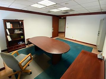 Office with cherry colored furniture 