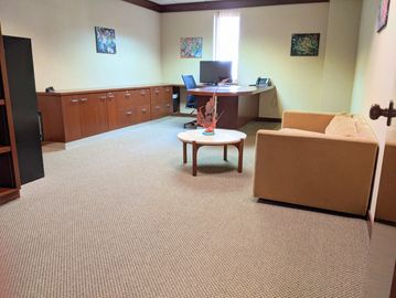 private office with brown furniture