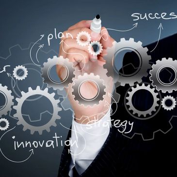 Businessman drawing gears representing strategy, innovation, and success.