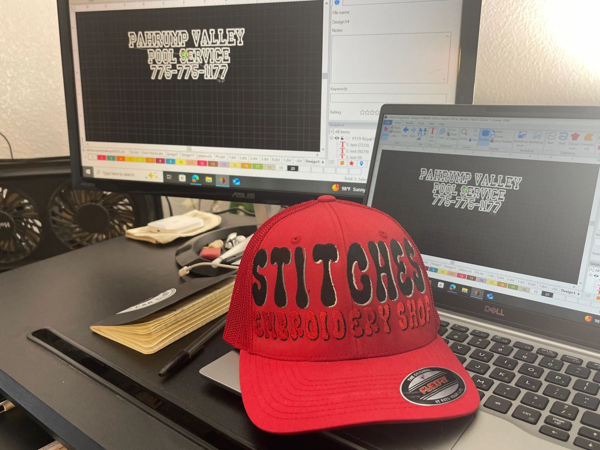 Stitches Embroidery Shop workbench — digitizing a design, finished cap in front