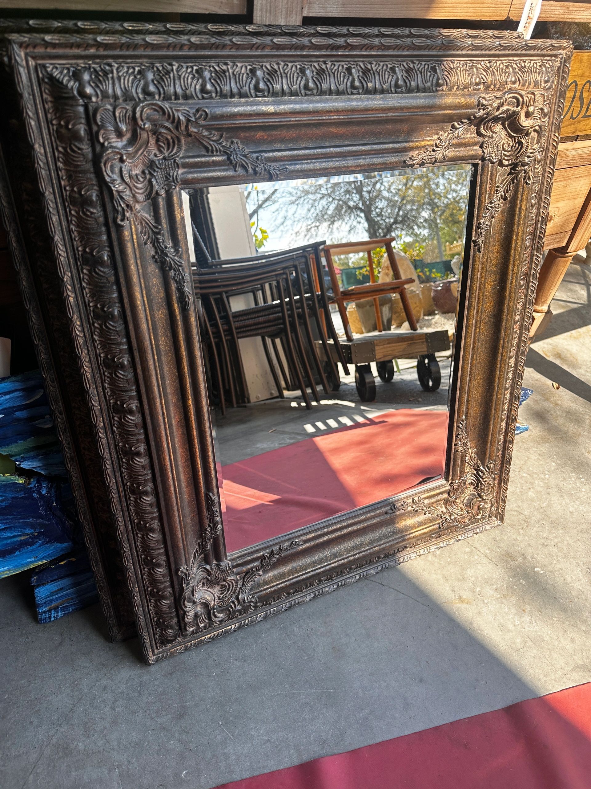 Wall Mirror with bevel glass in real wood frame in rich chestnut hues with fancy traditional designs