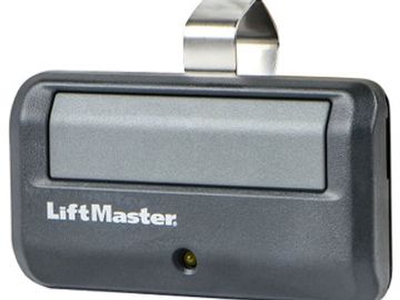 LiftMaster garage door opener remote control in black and gray.