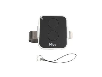 A black and white remote control with two buttons and a keychain loop.