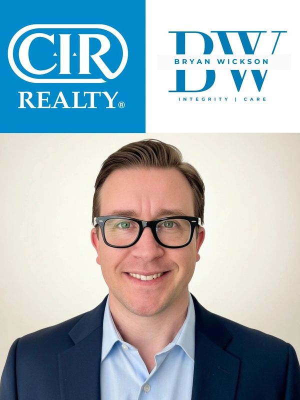 Professional portrait of a man with glasses in business attire, featuring CIR Realty and Bryan Wickson logos.