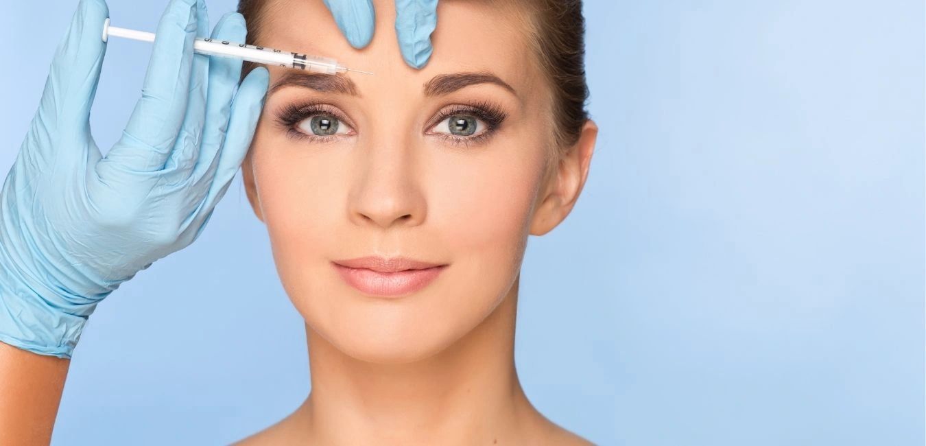 Women receiving a Botox shot.