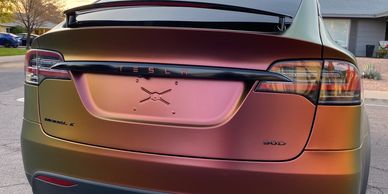 Custom emblems and lettering on rear of Tesla Model X