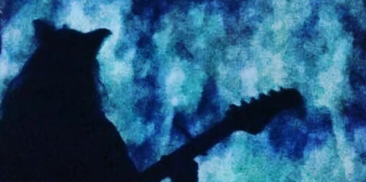 Silhouette of a person with a guitar against a blue textured background.
