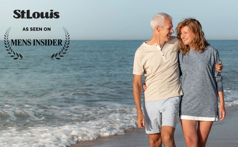 Happy mature couple walking by the ocean, featured in St. Louis Mens Insider.st. louis matchmaking