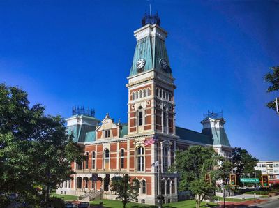 Reflection of the court house in the Commons glass. Photo credits: Don Nissan