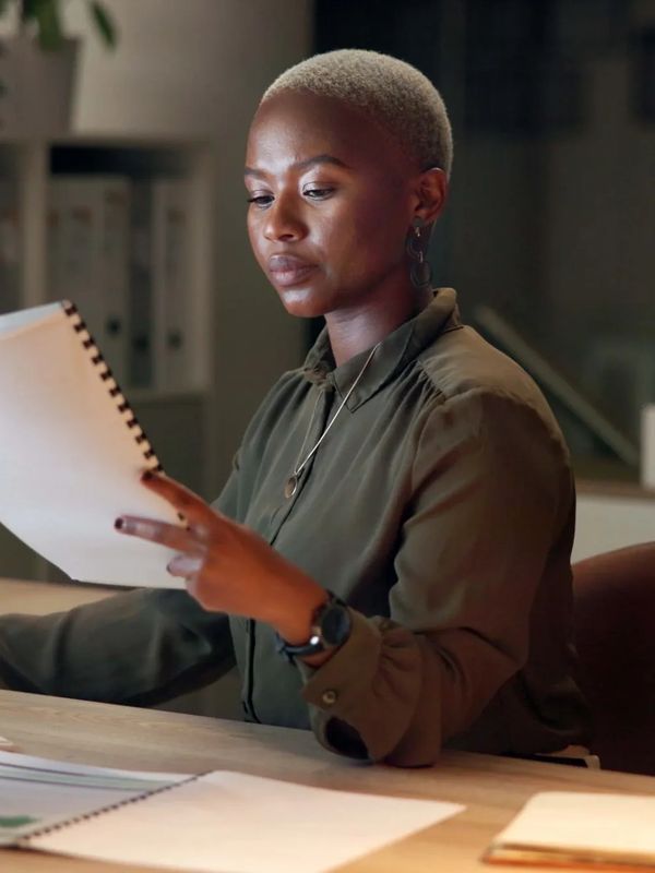 Lady working on a writing project. 