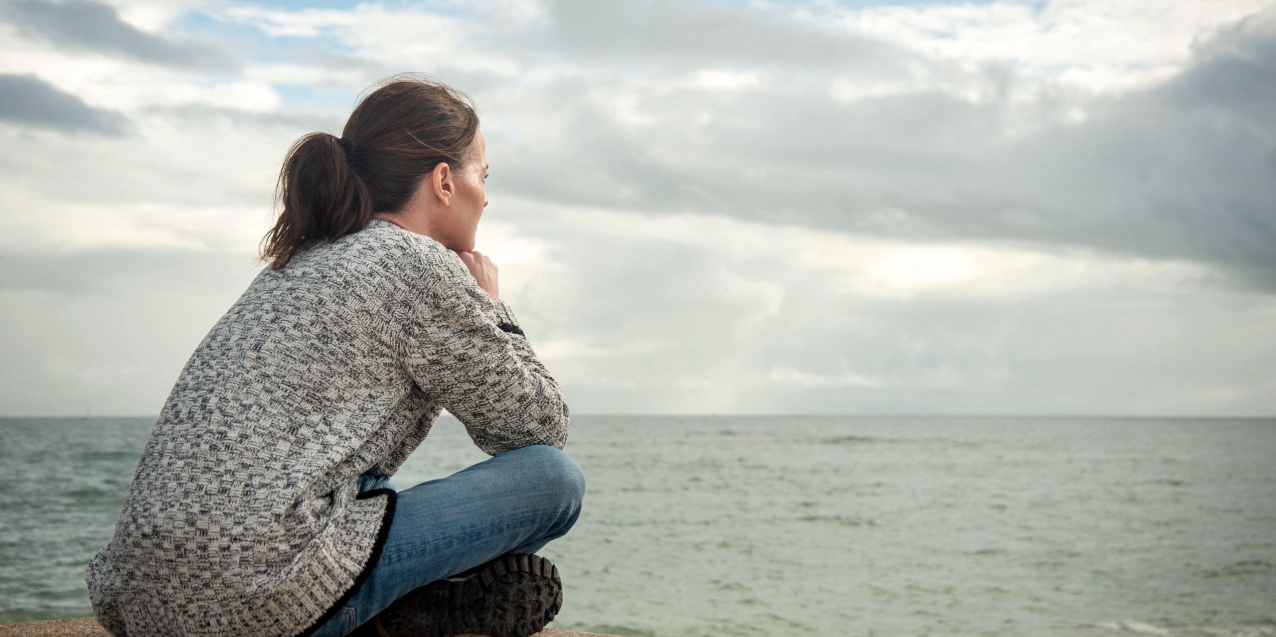 A woman who is worried, anxious, depressed, thinking about needing counselling